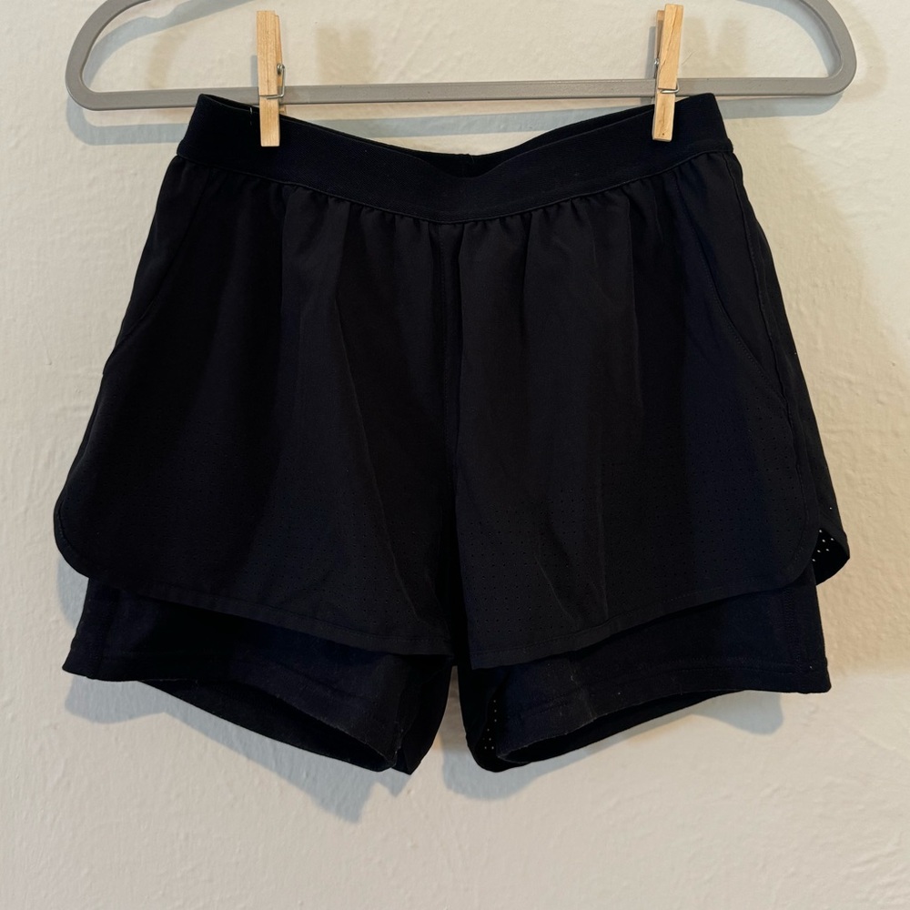 Black athletic shorts with spandex liner inside